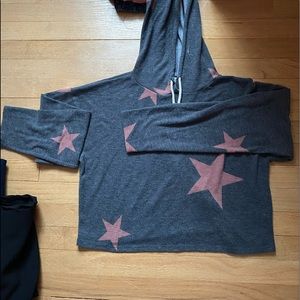 Gray sweatshirt with pink stars.